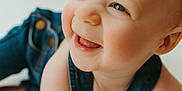 Jack joined the competition — help win amazing prizes! baby, child, smiling, denim, overalls, crawling, happy, face, blue_eyes, closeup, infant, skin, cheeks, mouth, tongue, light, soft_background, cute, portrait, person