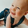 baby, child, smiling, denim, overalls, crawling, happy, face, blue_eyes, closeup, infant, skin, cheeks, mouth, tongue, light, soft_background, cute, portrait, person