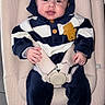 Jaden participe au concours pour gagner de l'argent avec cette photo : baby, baby_seat, child, clothing, comfort, cute, happy, hoodie, indoor, infant, person, portrait, safety_belt, seat, seated, smiling, striped_clothing, teddy_bear_patch, white_socks, young_child