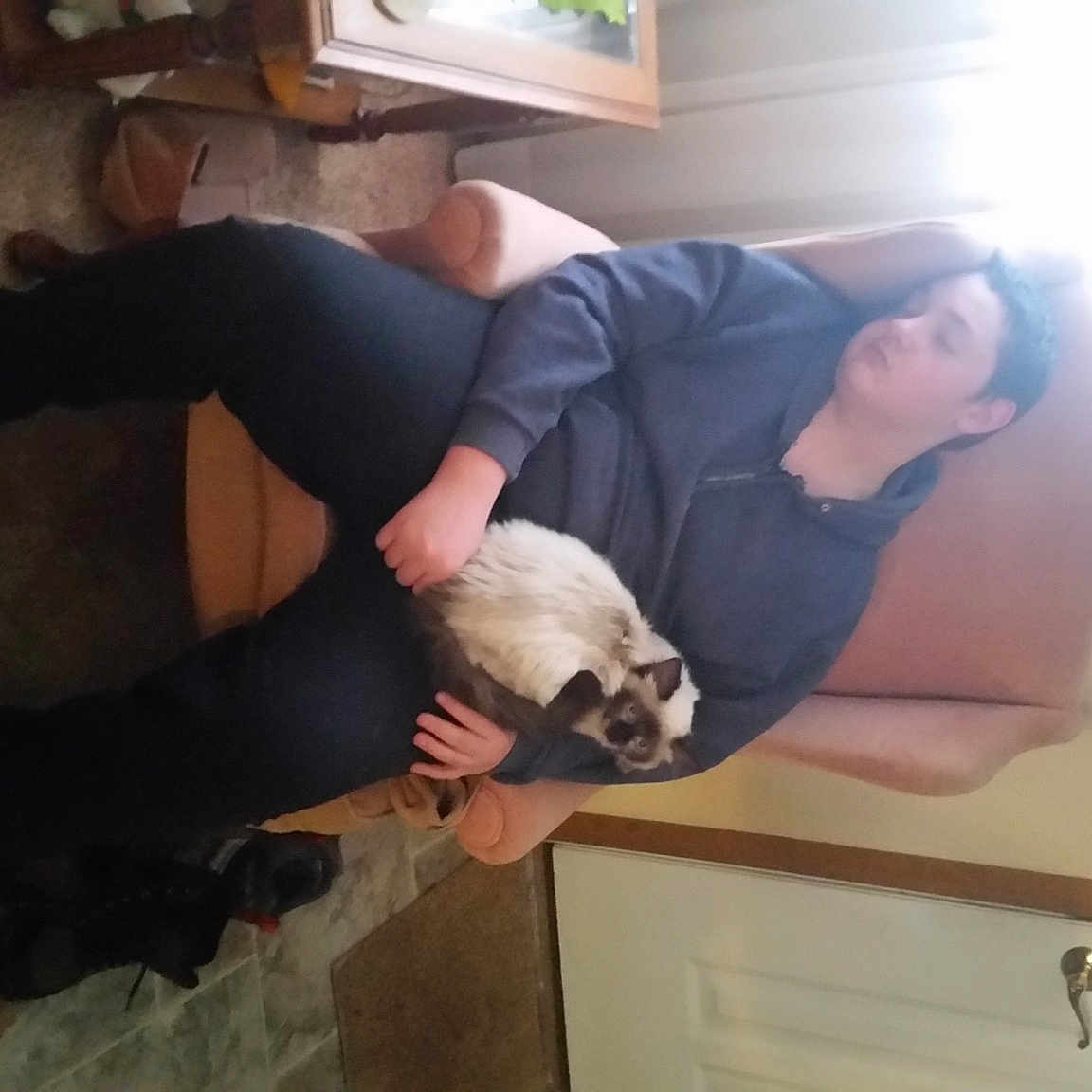 Shadow is registered to the contest to win money with this photo: arm, comfort, elbow, finger, floor, flooring, fun, gesture, hardwood, houseplant, joint, knee, leg, shoulder, sneakers, thigh, trunk, waist, wood, wrist