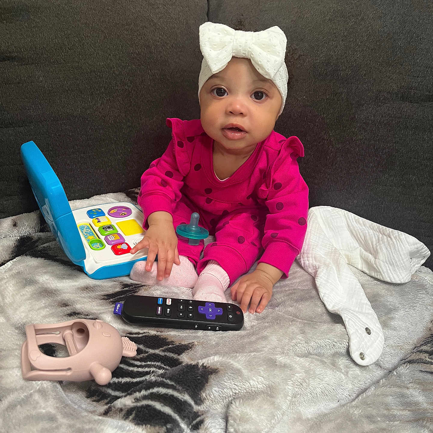 Jurnee Rose is registered to the contest to win money with this photo: baby, bodypart, cap, clothing, couch, cushion, electronics, face, finger, furniture, hand, hat, head, homedecor, person, phone, photography, portrait, remotecontrol, sitting