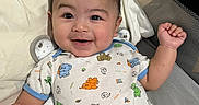 David is registered to the contest to win money with this photo: baby, bed, blanket, bodypart, clothing, crib, cushion, face, finger, furniture, hand, happy, head, homedecor, infantbed, newborn, person, photography, portrait, smile