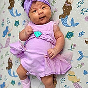 Sofia joined the competition — help win amazing prizes! baby, infant, child, portrait, smiling, happy, lying_down, lavender_outfit, dress, tutu, headband, flower, socks, mermaid_blanket, underwater_theme, nursery, indoors, closeup, baby_fashion, playful