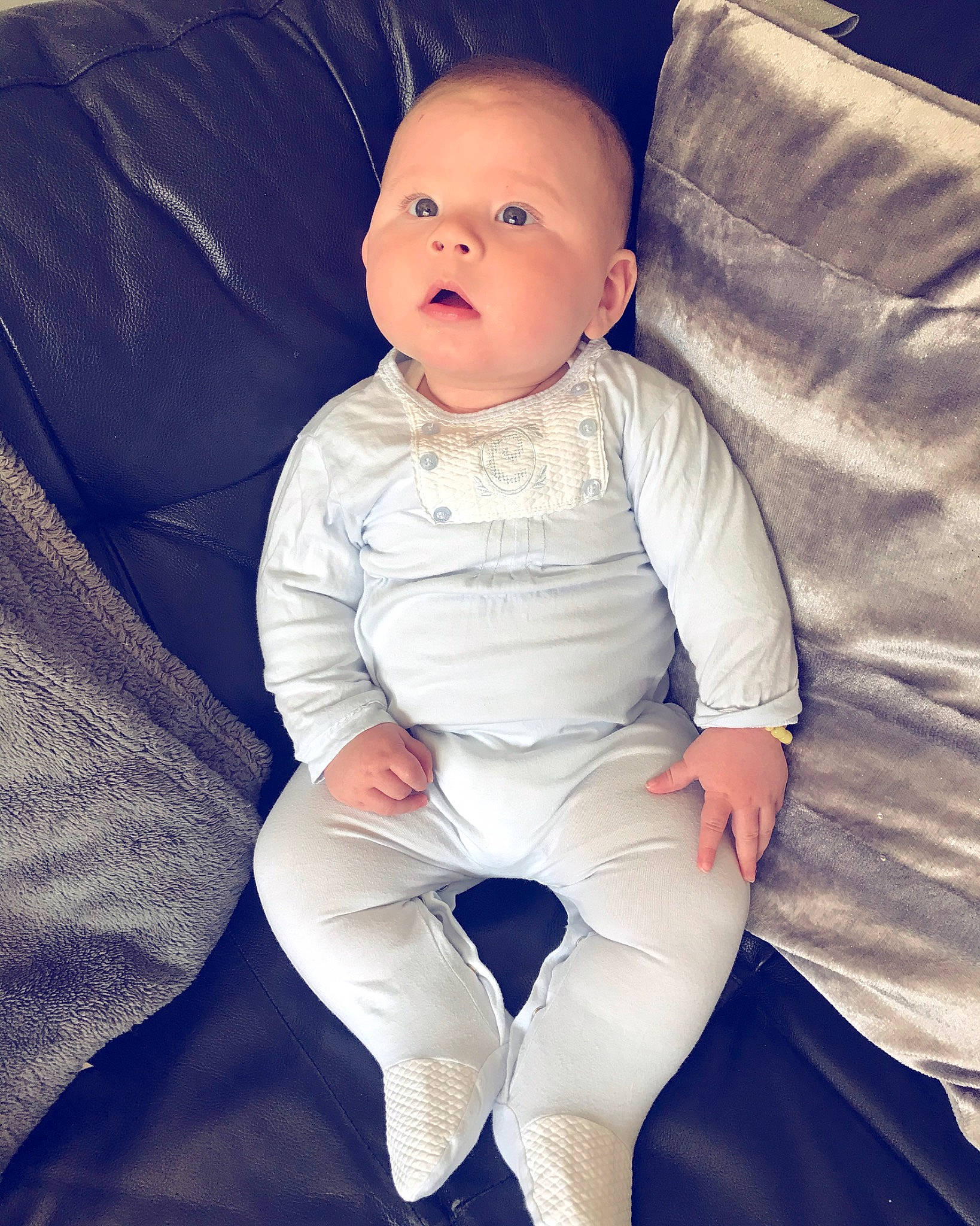 Kobi is registered to the contest to win money with this photo: arm, baby, baby_toddler_clothing, cheek, child, eye, head, leg, person, product, sitting, skin, sleeve, smile, toddler