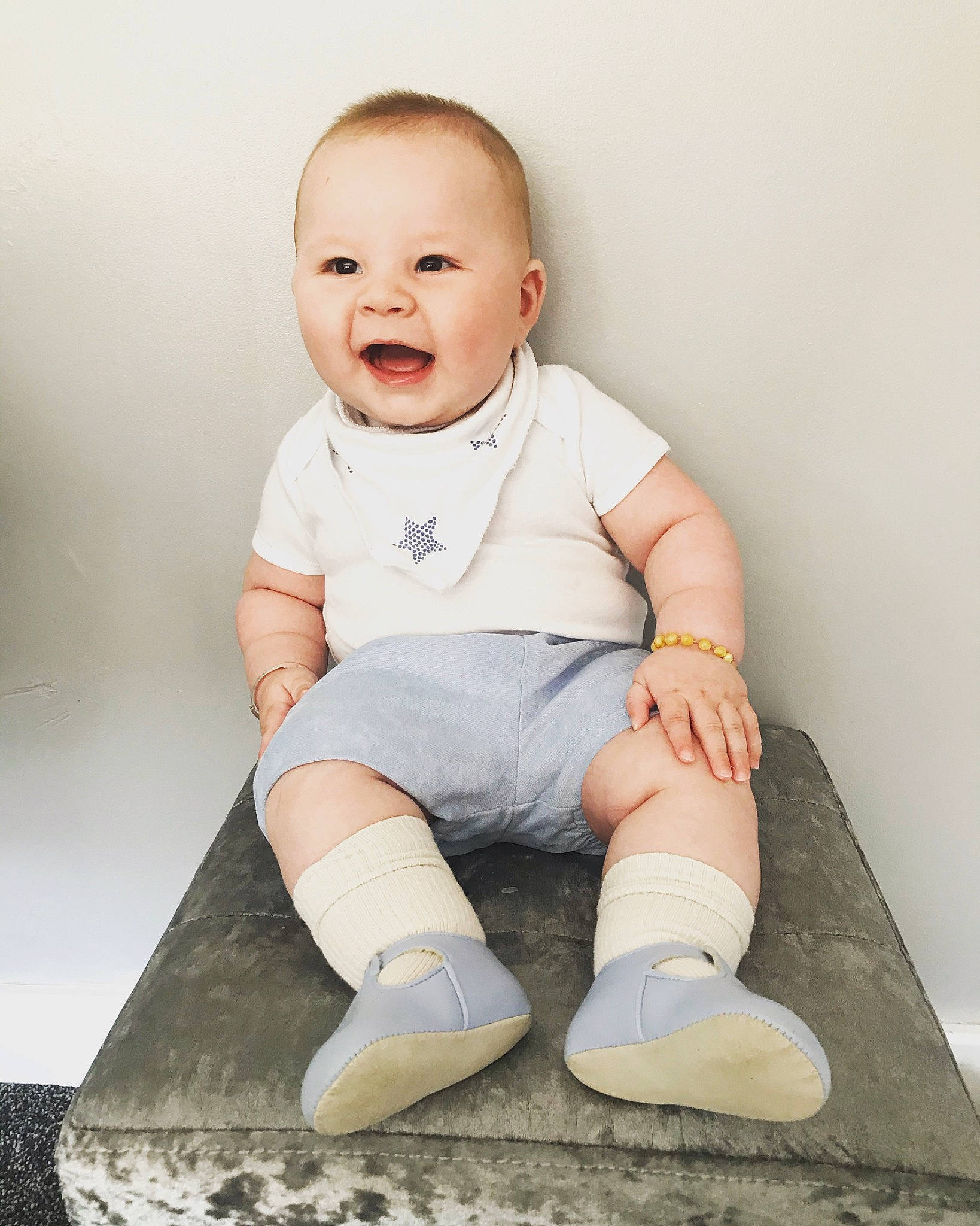 Kobi is registered to the contest to win money with this photo: baby, baby_toddler_clothing, child, child_model, footwear, knee, leg, person, photograph, photography, portrait, portrait_photography, shoe, sitting, sleeve, toddler