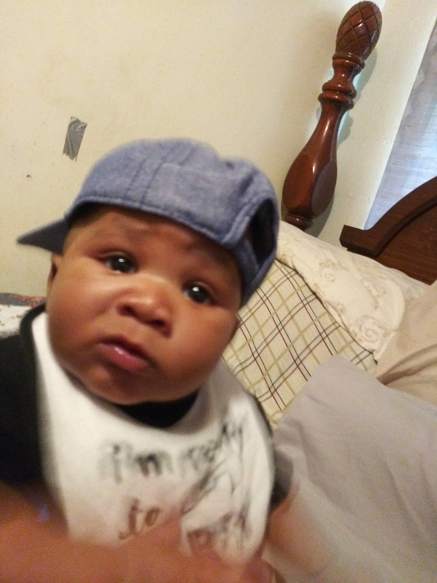 Javonte Dean is registered to the contest to win money with this photo: baby, baby_toddler_clothing, cap, cheek, comfort, ear, eyebrow, eyelash, fashion_accessory, finger, happy, headgear, headwear, kitchen_utensil, lip, musical_instrument, nose, person, sleeve, thumb
