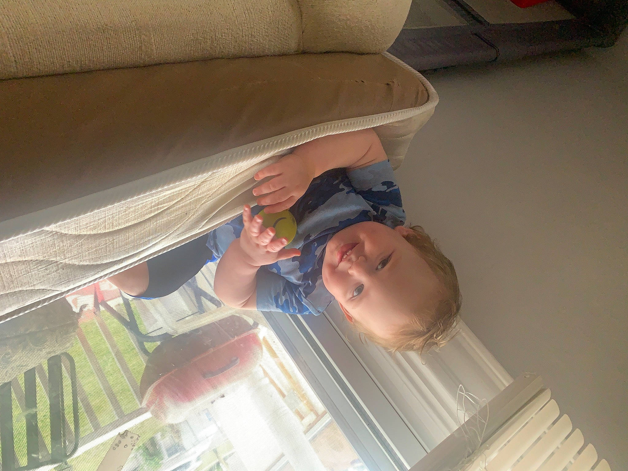 Eli is registered to the contest to win money with this photo: ceiling, child, comfort, elbow, hardwood, joy, person, room, shade, tints_and_shades, wood