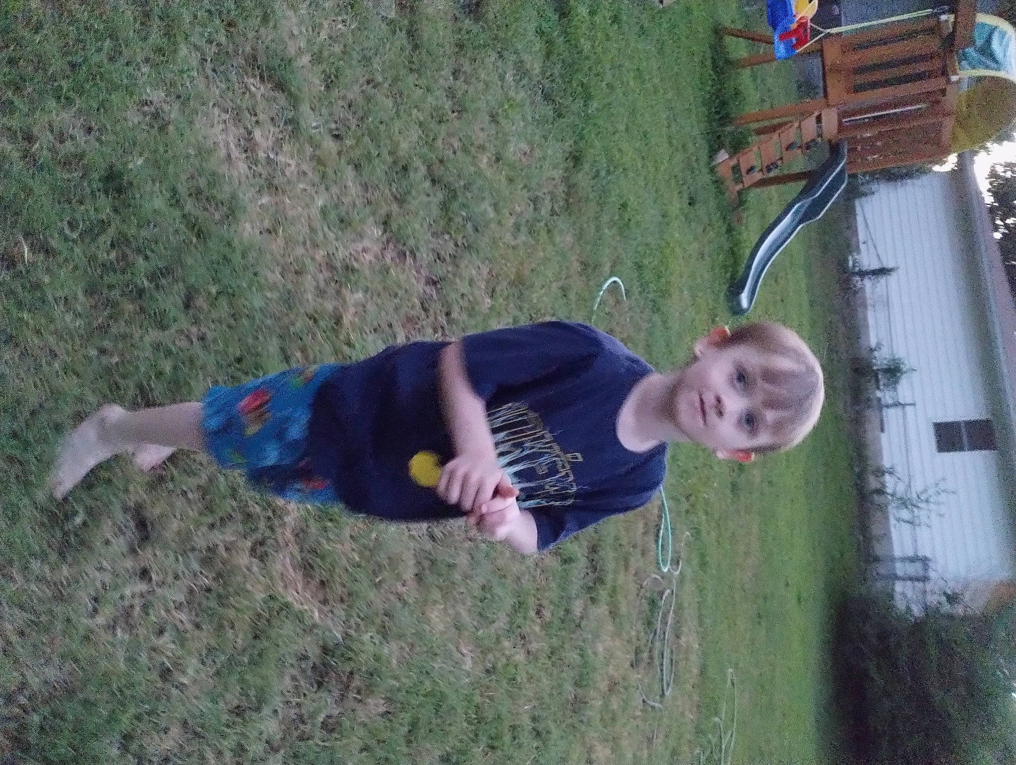 Kurtis is registered to the contest to win money with this photo: elbow, fun, grass, grassland, happy, landscape, leisure, people_in_nature, person, plant, recreation, smile, t_shirt, tree