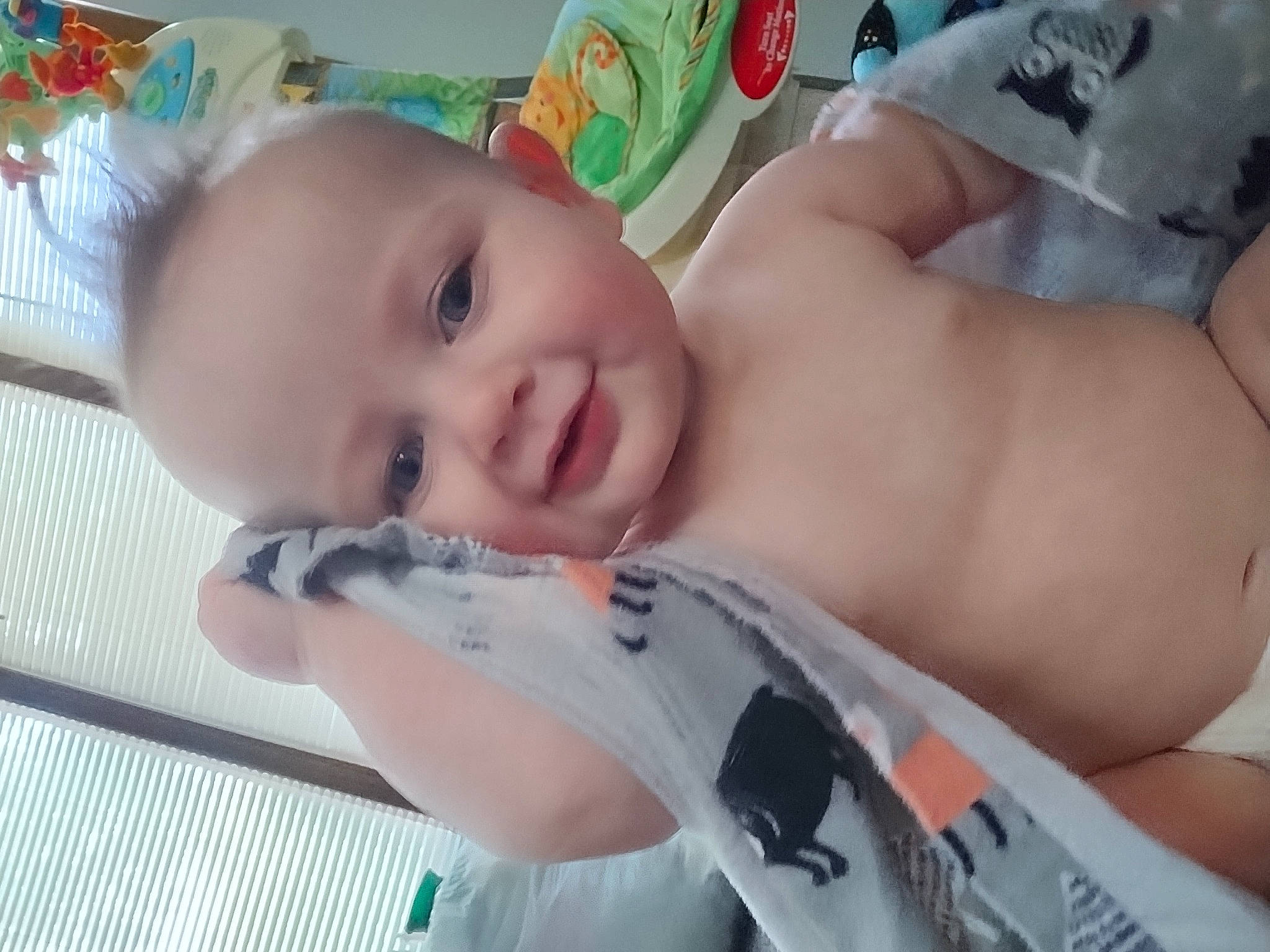 Ryker is registered to the contest to win money with this photo: abdomen, baby, baby_products, baby_safety, baby_toddler_clothing, cheek, chest, child, elbow, eyebrow, eyelash, fun, happy, joy, pattern, person, room, skin, smile, thumb