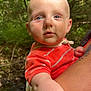 baby, child, blue_eyes, red_shirt, striped_clothing, outdoor, forest, greenery, nature, person, holding, arm, tattoo, daylight, stream, curious, infant, portrait, closeup, human