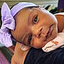 Novi joined the competition — help win amazing prizes! accessories, baby, bonnet, cap, clothing, earring, face, happy, hat, head, headband, indoors, jewelry, newborn, person, photography, portrait, purple, smile, towel