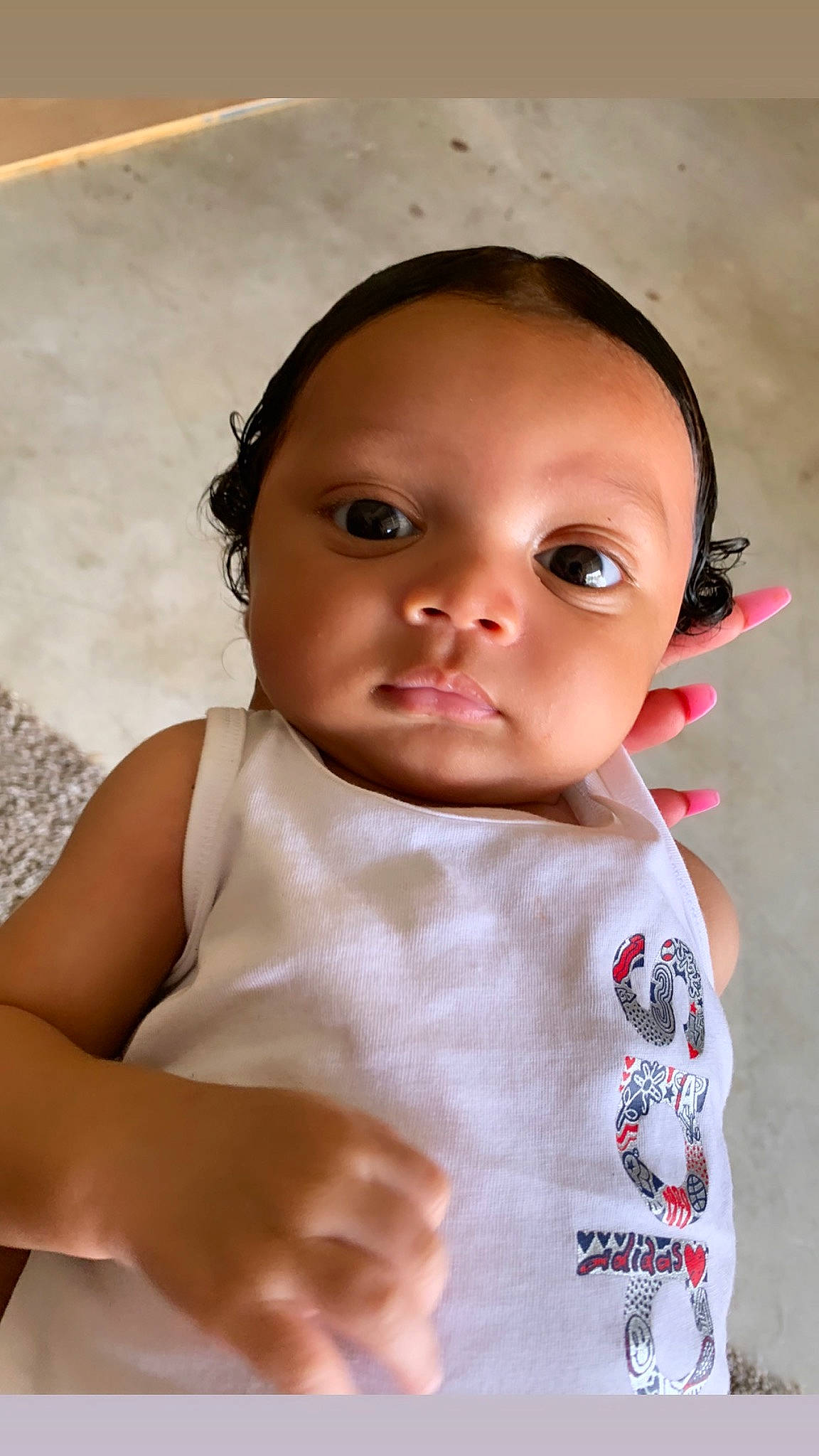 Peter is registered to the contest to win money with this photo: baby, baby_toddler_clothing, cheek, chin, dress, eye, eyebrow, eyelash, gesture, hairstyle, happy, head, human_body, iris, lip, mouth, neck, nose, person, skin