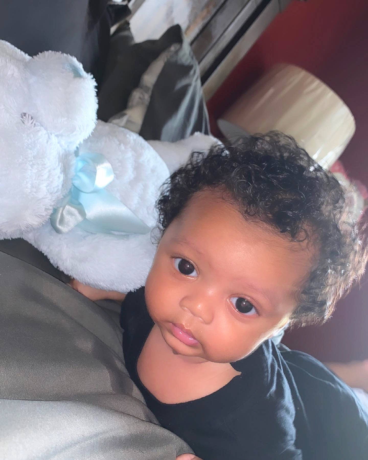 Peter is registered to the contest to win money with this photo: baby, baby_toddler_clothing, cheek, child, comfort, eyelash, face, fashion_accessory, flash_photography, fun, fur, gesture, happy, headgear, nose, person, sitting, skin, stuffed_toy, textile