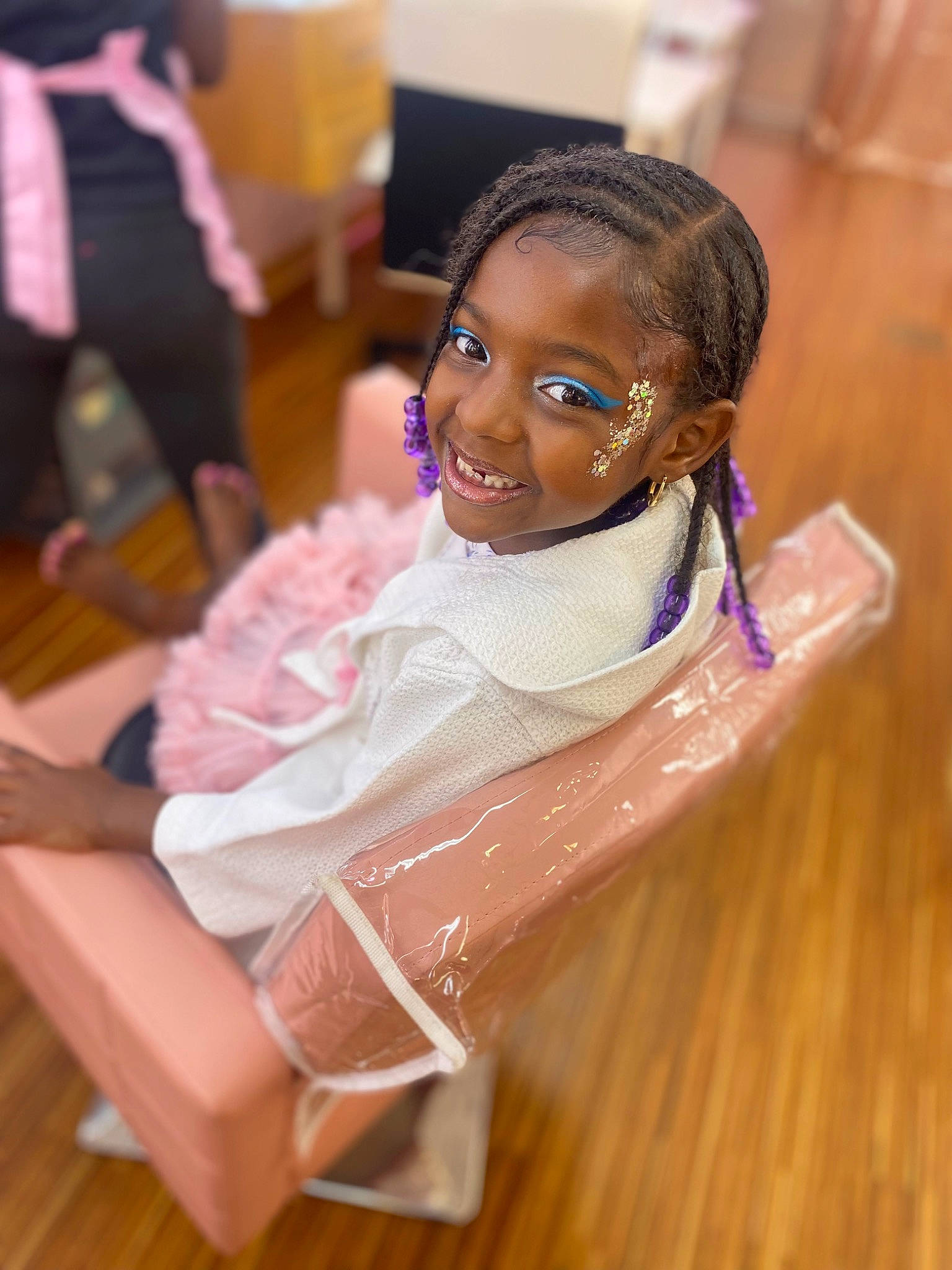 Angel is registered to the contest to win money with this photo: black_hair, chair, event, fashion_accessory, fashion_design, floor, flooring, formal_wear, fun, hair_accessory, happy, hardwood, jewellery, joy, leisure, person, room, skin, smile, toddler