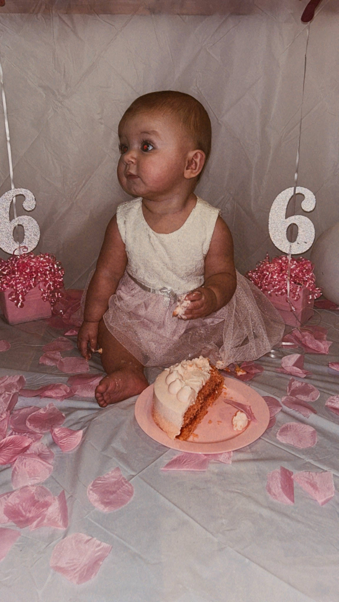 Ember is registered to the contest to win money with this photo: baby, baby_toddler_clothing, baked_goods, birthday, birthday_cake, cake, cake_decorating, child, dessert, dress, event, food, person, pink, plate, sugar_cake, sugar_paste, sweetness, table, tableware