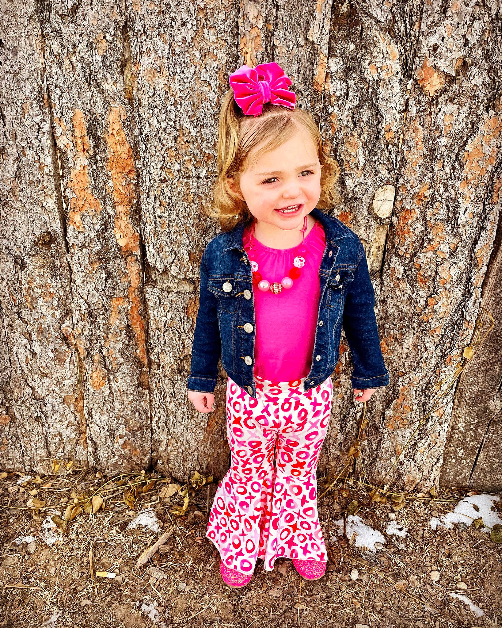 Emma is registered to the contest to win money with this photo: baby_toddler_clothing, clothing, cool, dress, eye, face, grass, happy, head, jacket, joy, leg, magenta, outerwear, people_in_nature, person, pink, sleeve, smile, toddler