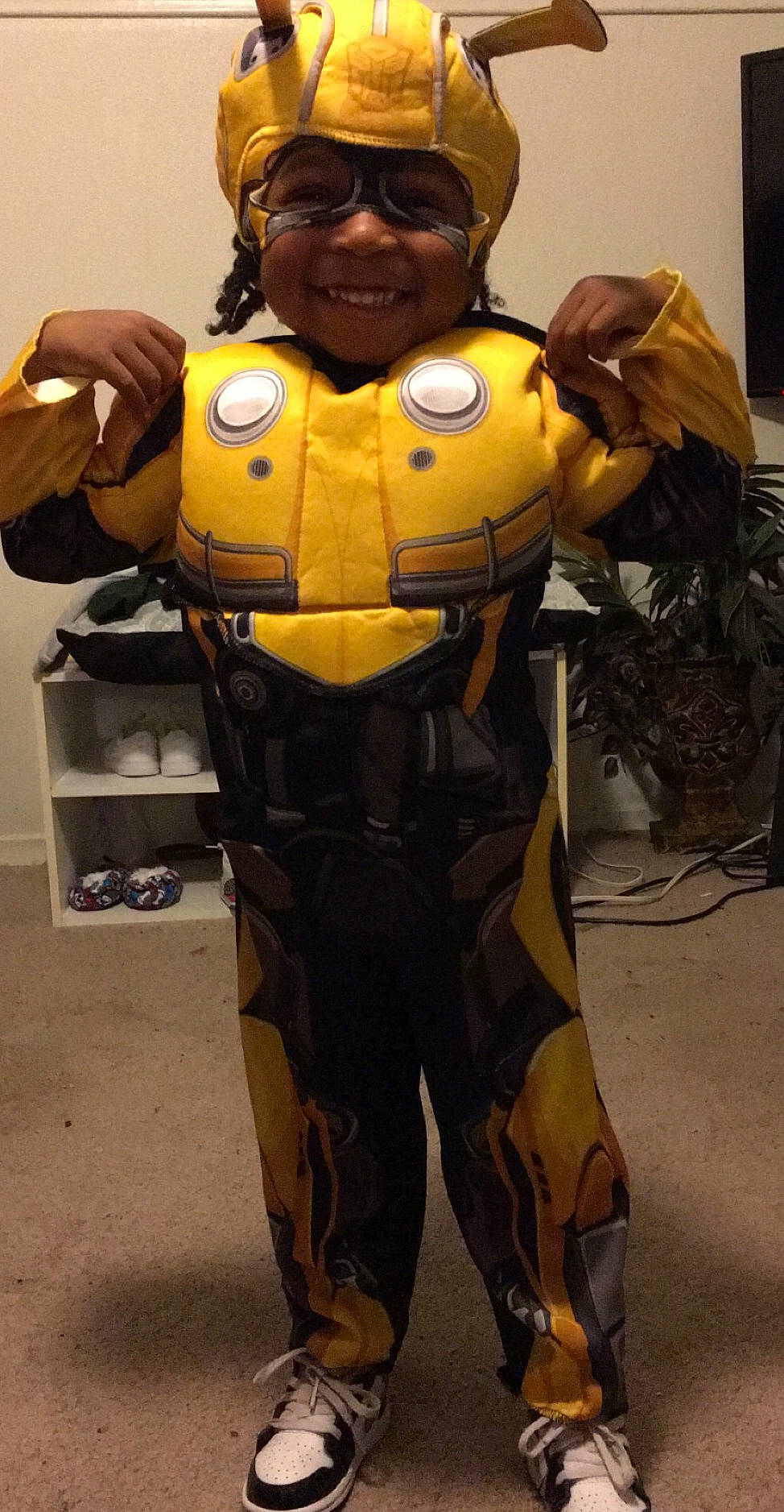 Damion is registered to the contest to win money with this photo: action_figure, animation, costume, fictional_character, headwear, joy, person, suit_actor, yellow