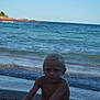 child, boy, beach, ocean, shore, waves, water, sky, sand, shoreline, nature, outdoor, summer, vacation, portrait, person, blond_hair, sea, coast, relaxation