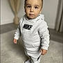Noham a rejoint le concours — aidez-le/la à gagner de superbes lots ! toddler, child, boy, nike, hoodie, sweatpants, sneakers, indoor, carpet, standing, portrait, fashion, clothing, casual, young, cute, expression, eyes, soft_focus, blurred_background