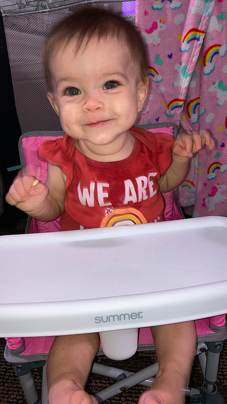 Alice is registered to the contest to win money with this photo: baby, baby_toddler_clothing, cheek, child, face, facial_expression, finger, gesture, happy, head, iris, joy, lip, nose, person, photograph, pink, product, skin, smile