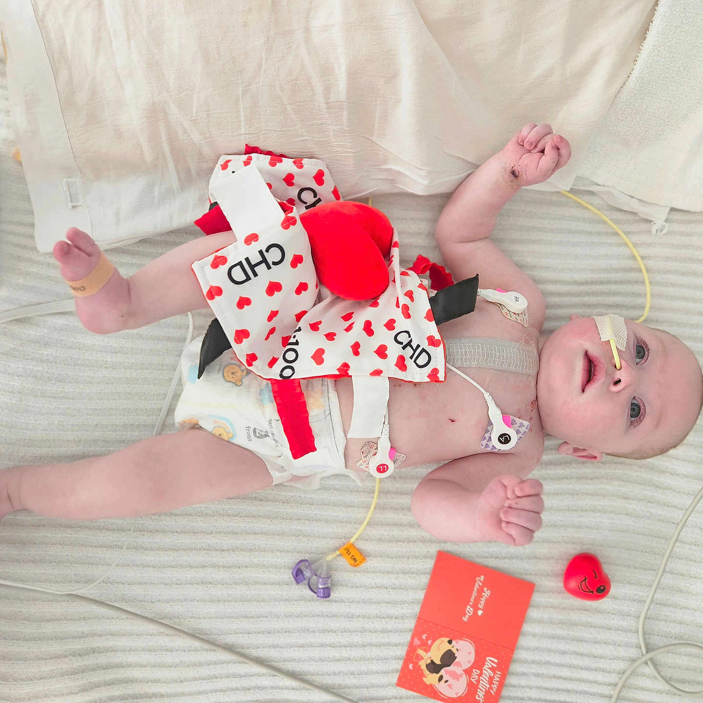 Kendrick is registered to the contest to win money with this photo: applique, architecture, baby, bed, bedroom, blanket, bodypart, bonnet, building, clothing, couch, cradle, crib, cushion, diaper, face, finger, furniture, hand, hat