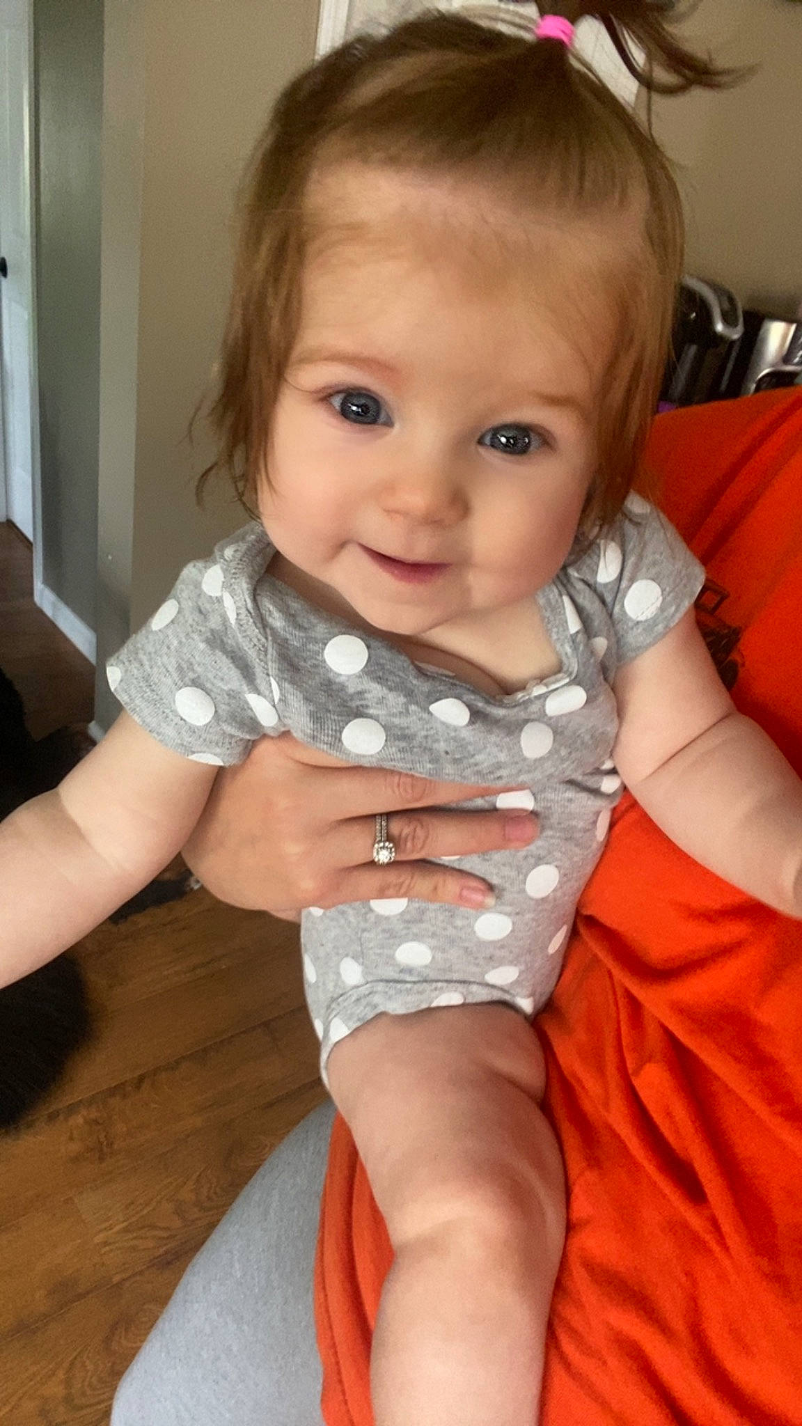 Cecilia is registered to the contest to win money with this photo: arm, baby_toddler_clothing, cheek, chest, chin, dress, eye, eyebrow, finger, gesture, iris, joint, lip, mouth, neck, nose, person, skin, sleeve, smile