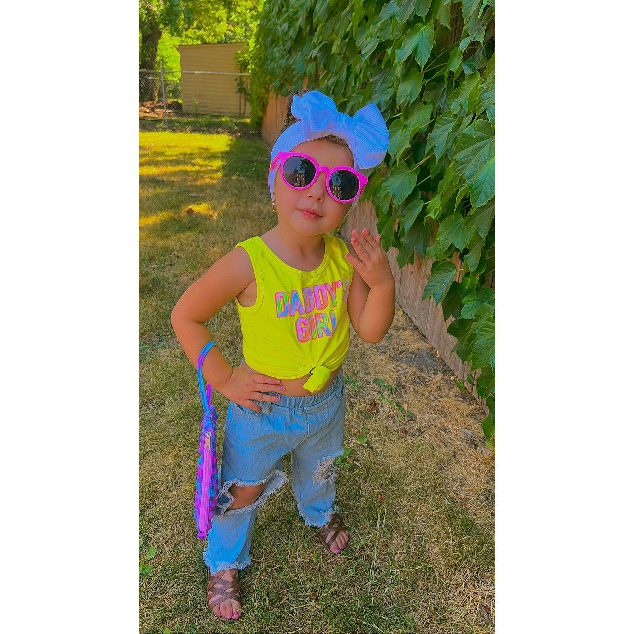 Emma Mae is registered to the contest to win money with this photo: aqua, baby_toddler_clothing, cool, eyewear, glasses, goggles, grass, happy, head, headgear, headwear, people_in_nature, person, pink, plant, sleeve, smile, sunglasses, t_shirt, toddler