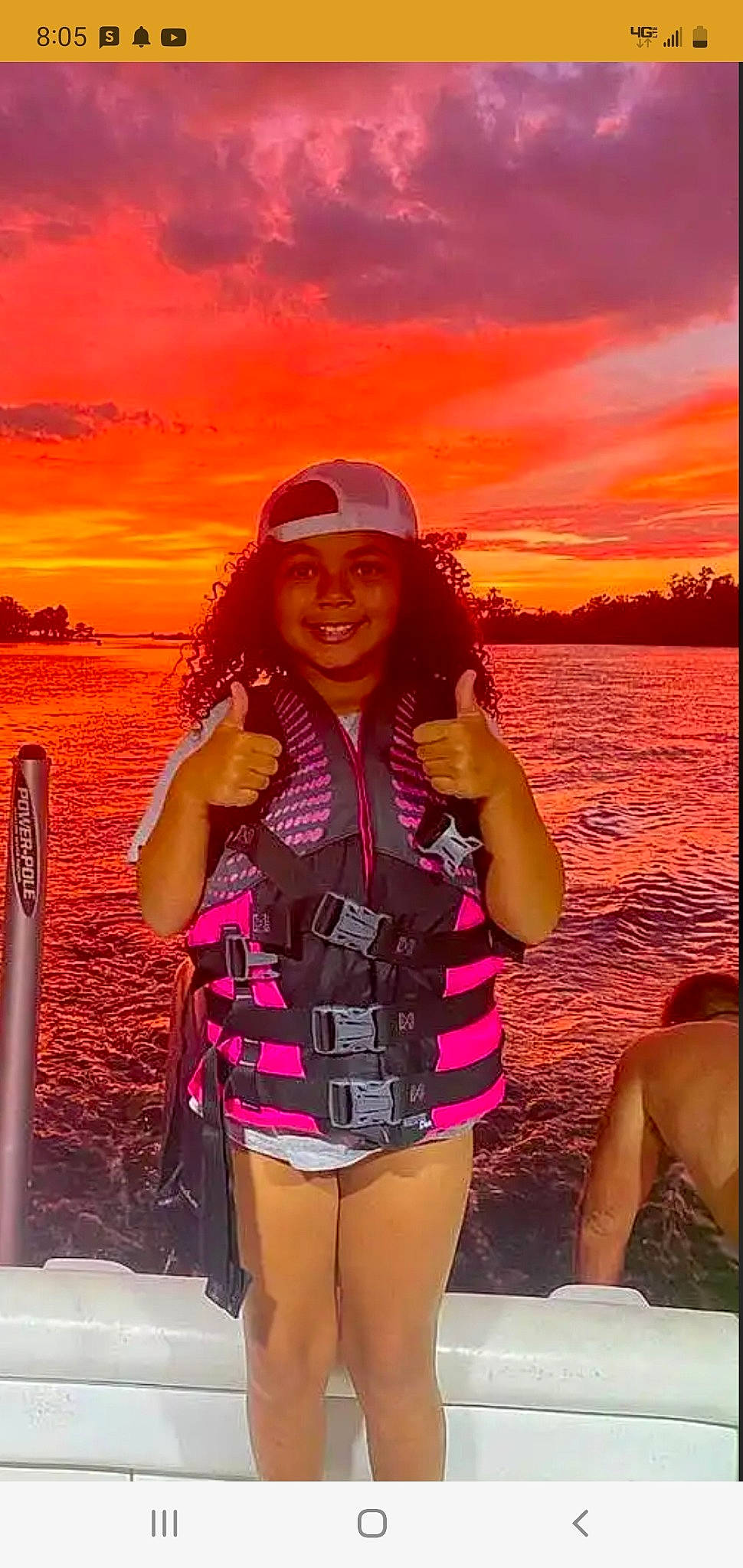 Haylei is registered to the contest to win money with this photo: body_of_water, cloud, eyewear, flash_photography, fun, gesture, happy, headwear, joy, leisure, magenta, people_in_nature, person, photograph, pink, sky, smile, summer, sunlight, thigh