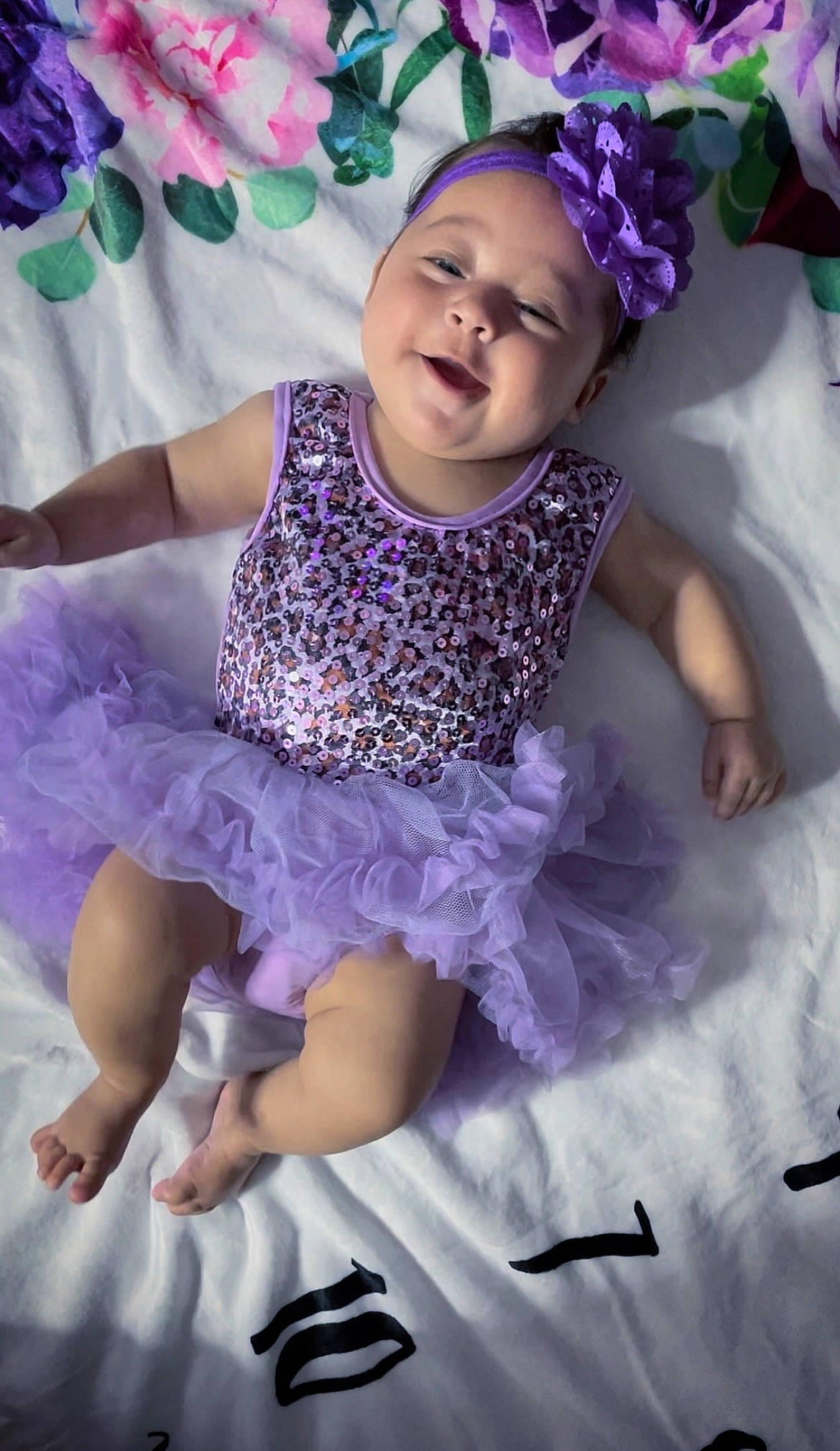 Freya joined the competition — help win amazing prizes! baby, baby_toddler_clothing, beauty, dress, entertainment, event, facial_expression, flash_photography, fun, happy, headpiece, magenta, performing_arts, person, petal, photograph, pink, purple, smile, toddler