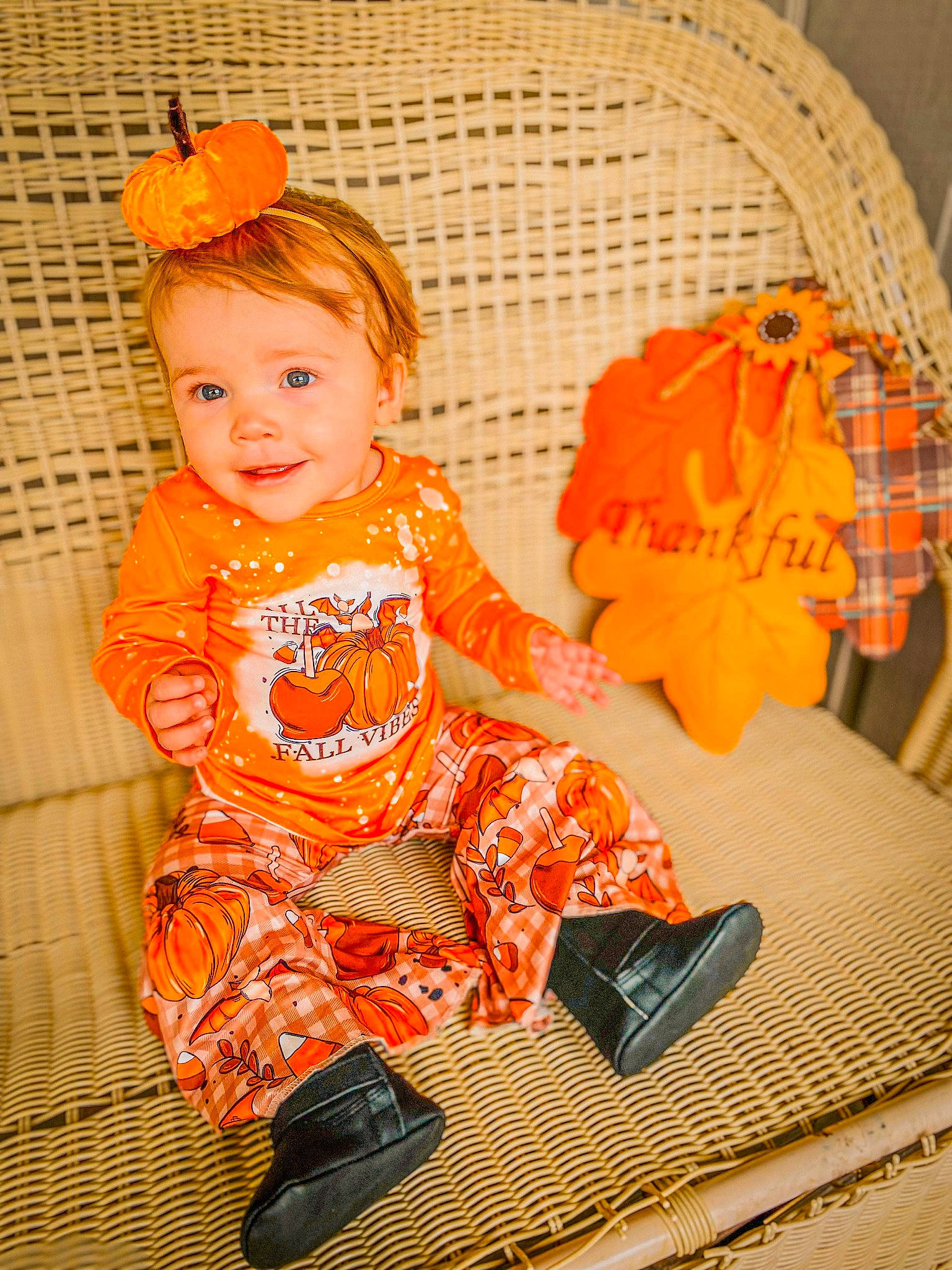 Winter is registered to the contest to win money with this photo: baby, baby_products, baby_toddler_clothing, child, fashion_accessory, flooring, fun, happy, joy, linens, orange, pattern, peach, person, product, room, sitting, sleeve, smile, sock