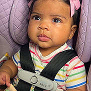 Wavie joined the competition — help win amazing prizes! baby, car_seat, child, pink_bows, striped_clothing, book, animal_book, curious_eyes, infant, seatbelt, safety_harness, purple_car_seat, cute, portrait, indoor, child_safety, early_childhood, toddler, hand, face