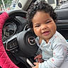 Wavie joined the competition — help win amazing prizes! baby, child, car, steering_wheel, curly_hair, infant, seat, clothing, smile, happy, interior, vehicle, dashboard, window, hand, person, cute, playful, seatbelt, mazda
