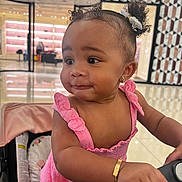 Davi is registered to the contest to win money with this photo: accessories, baby, bag, bodypart, clothing, dress, face, finger, hair, hand, handbag, happy, head, jewelry, person, photography, portrait, shoulder, sitting, smile