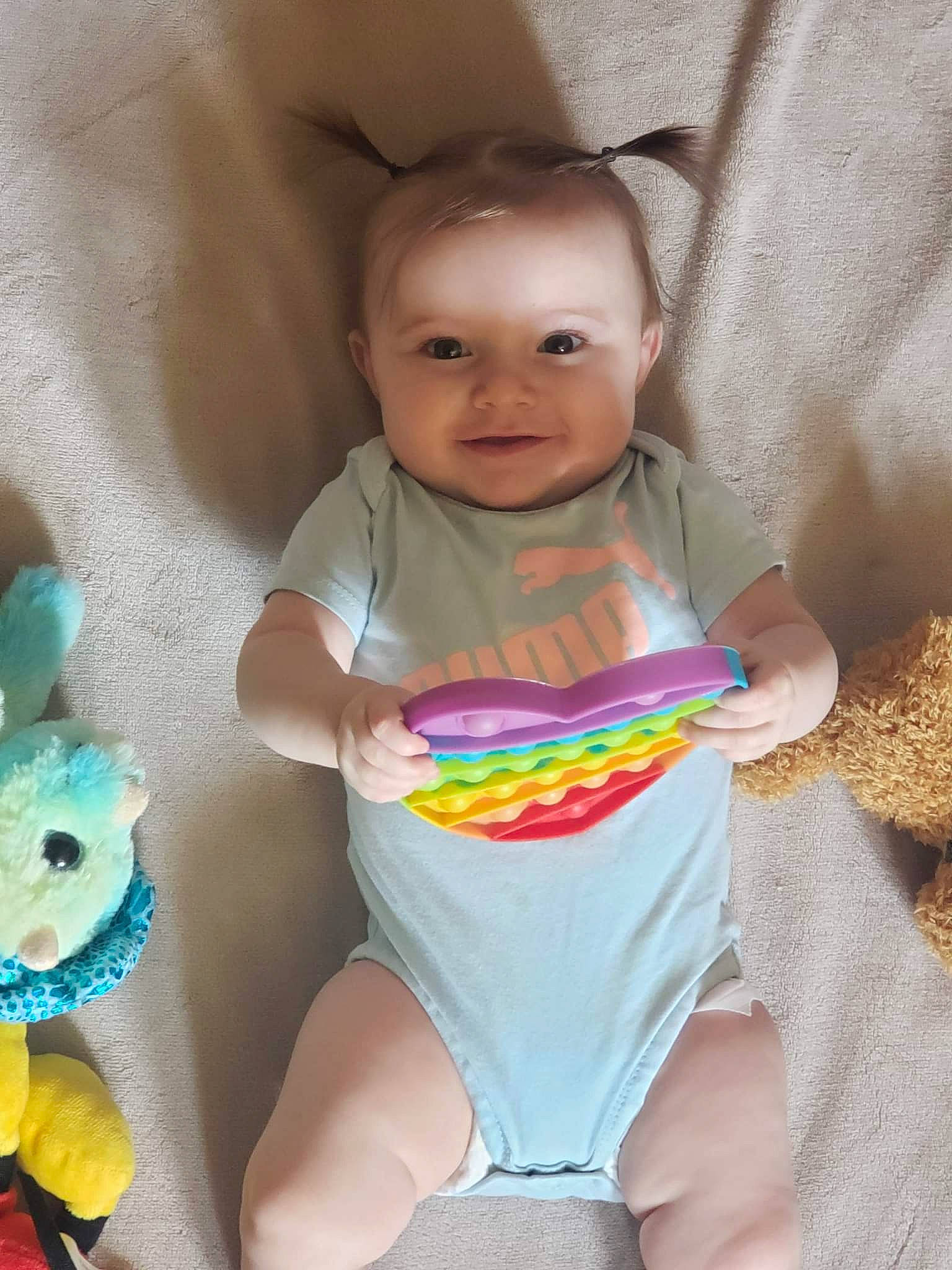 Veronika is registered to the contest to win money with this photo: arm, baby, baby_toddler_clothing, cheek, eye, face, hairstyle, hand, happy, head, iris, neck, person, pink, product, skin, sleeve, smile, stomach, textile