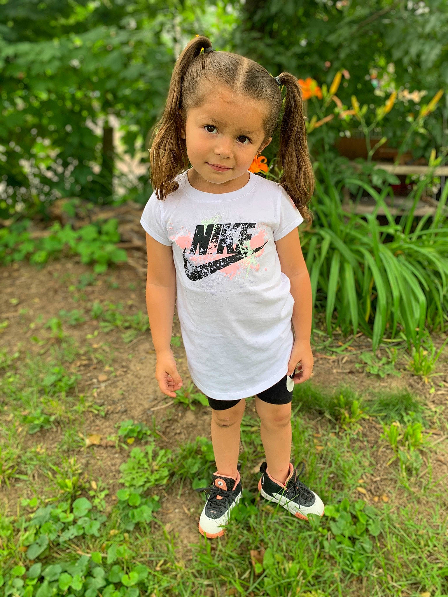 Laylani is registered to the contest to win money with this photo: child, eye, forest, grass, grass_family, hairstyle, happy, head, leisure, natural_environment, people_in_nature, person, plant, recreation, sandal, shorts, sleeve, t_shirt, terrestrial_plant, toddler