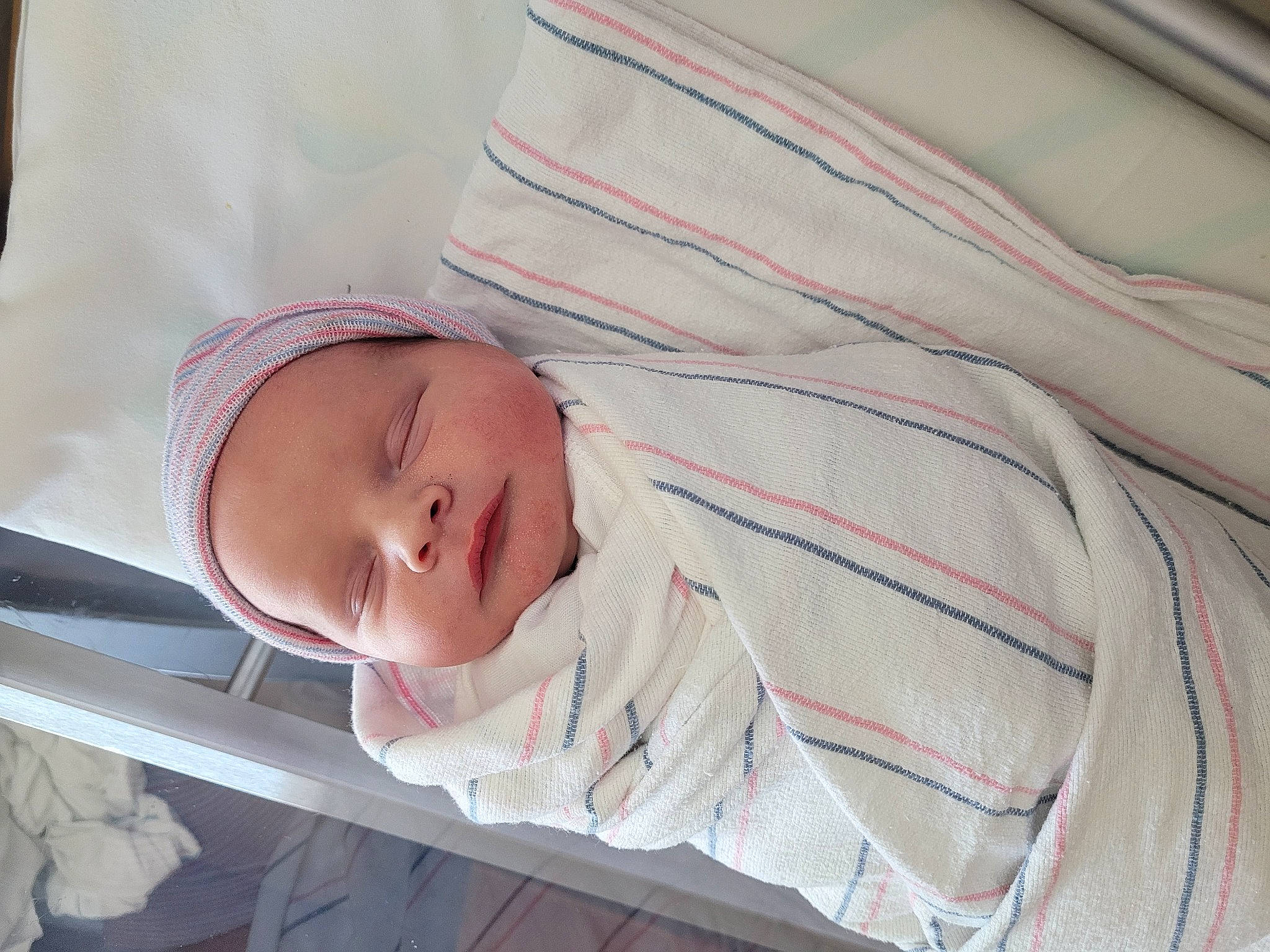 Ian is registered to the contest to win money with this photo: baby, baby_products, baby_safety, baby_sleeping, baby_toddler_clothing, bedding, bedtime, child, comfort, hat, linens, nap, person, portrait_photography, room, skin, sleep, sleeve, toddler, tree