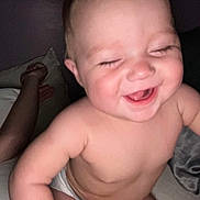 Kaelen joined the competition — help win amazing prizes! baby, child, laughing, diaper, smiling, cute, chubby, indoor, bed, pillow, person, skin, face, happy, infant, toddler, laugh, human, young