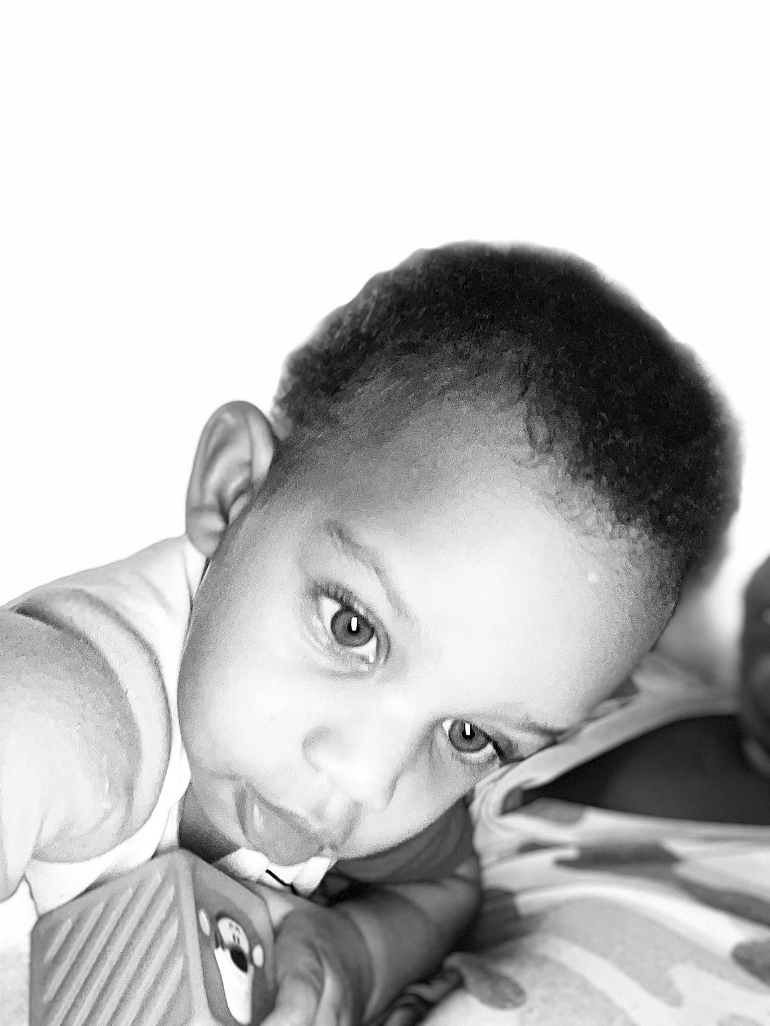 Christian is registered to the contest to win money with this photo: baby, baby_toddler_clothing, cheek, child, comfort, ear, elbow, eye, eyelash, flash_photography, gesture, happy, iris, monochrome, monochrome_photography, nose, person, portrait_photography, sitting, skin