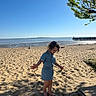 barefoot, beach, casual, child, denim_dress, nature, outdoor, pier, relaxation, sand, sea, shadow, shore, sky, summer, sunlight, tree, vacation, water, young