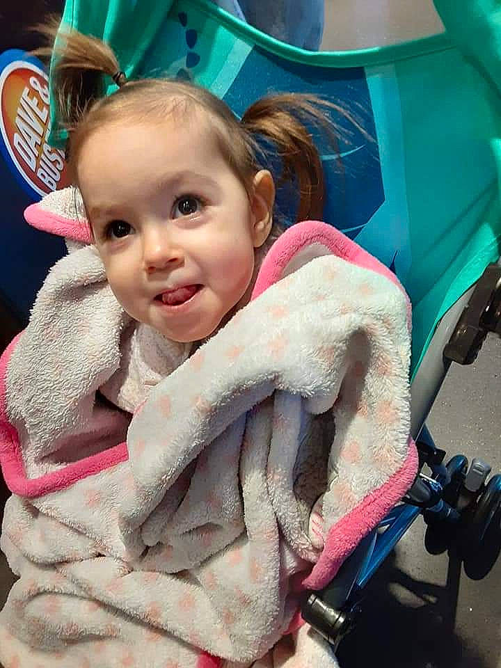 Leeann is registered to the contest to win money with this photo: baby, baby_carriage, baby_products, cheek, child, event, fun, happy, leisure, people, person, pink, product, recreation, sitting, skin, smile, snapshot, textile, toddler