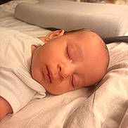 Jamesy participe au concours pour gagner de l'argent avec cette photo : baby, bed, blanket, calm, child, closeup, comfort, face, head, indoors, infant, newborn, peaceful, portrait, quiet, rest, skin, sleeping, soft_lighting, white_clothing