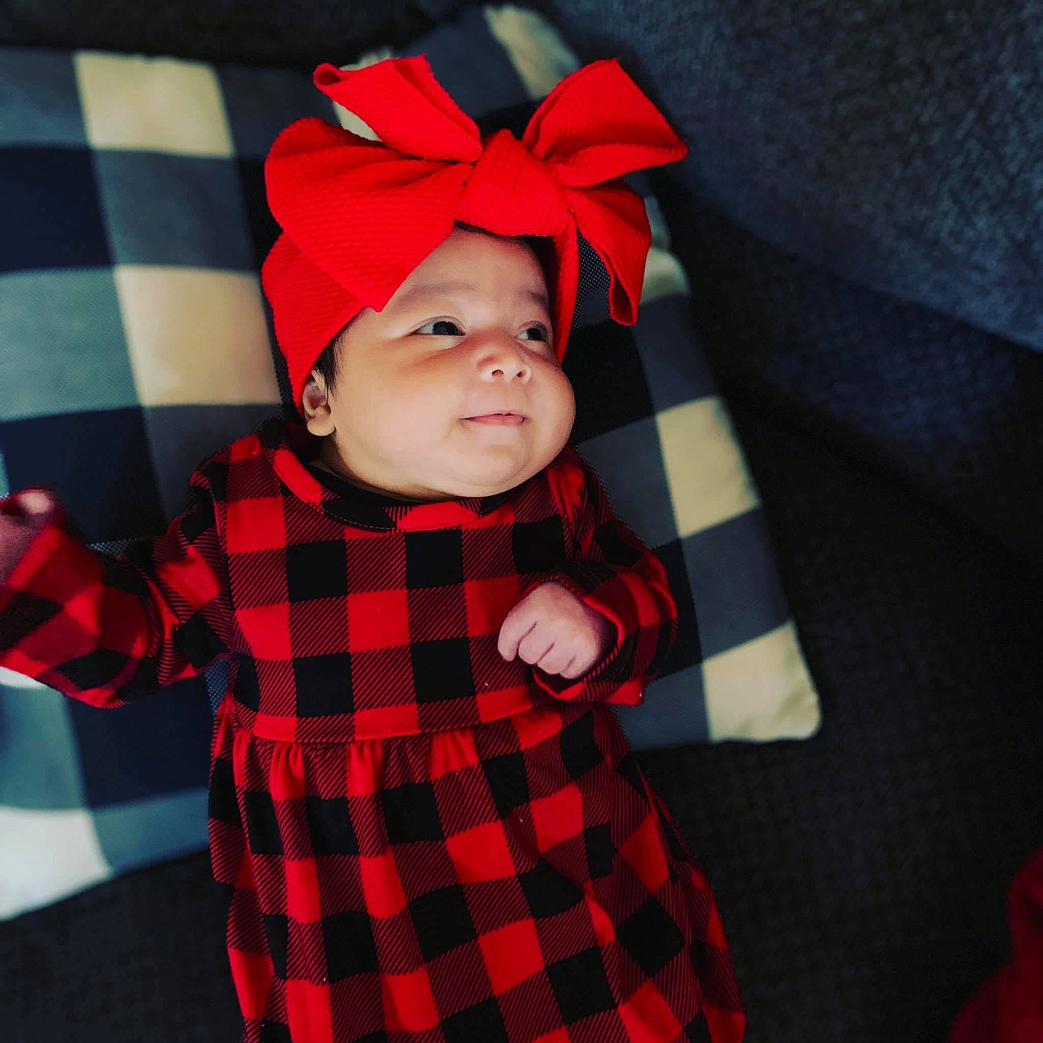Julianne is registered to the contest to win money with this photo: baby, baby_products, baby_toddler_clothing, button, child, child_model, costume, costume_accessory, design, hair_accessory, headband, headwear, pattern, person, plaid, polka_dot, red, sleeve, tartan, textile