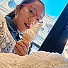 blue_sky, building, casual_clothing, child, crochet, denim, dessert, face, food, glasses, hand, ice_cream, indoor, light, person, smiling, soft_serve, texture, window, young