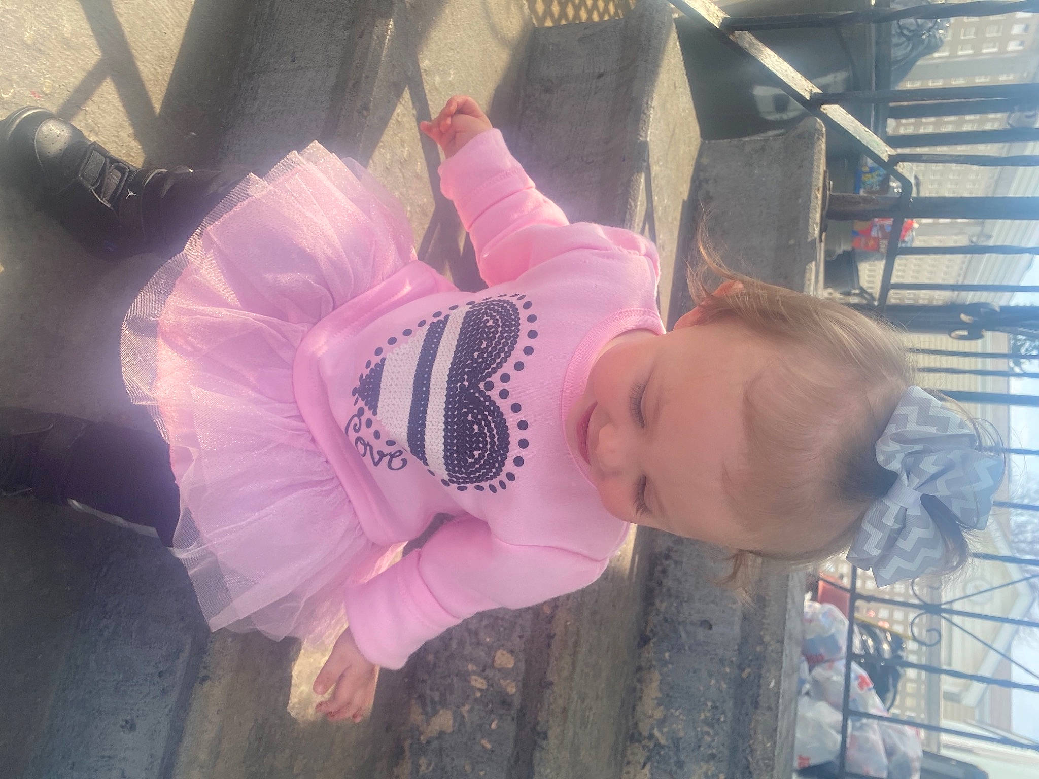 Scarlet is registered to the contest to win money with this photo: baby, baby_products, baby_toddler_clothing, child, dress, fun, happy, hat, magenta, person, pink, plant, purple, room, tire, toddler, tree, violet, window