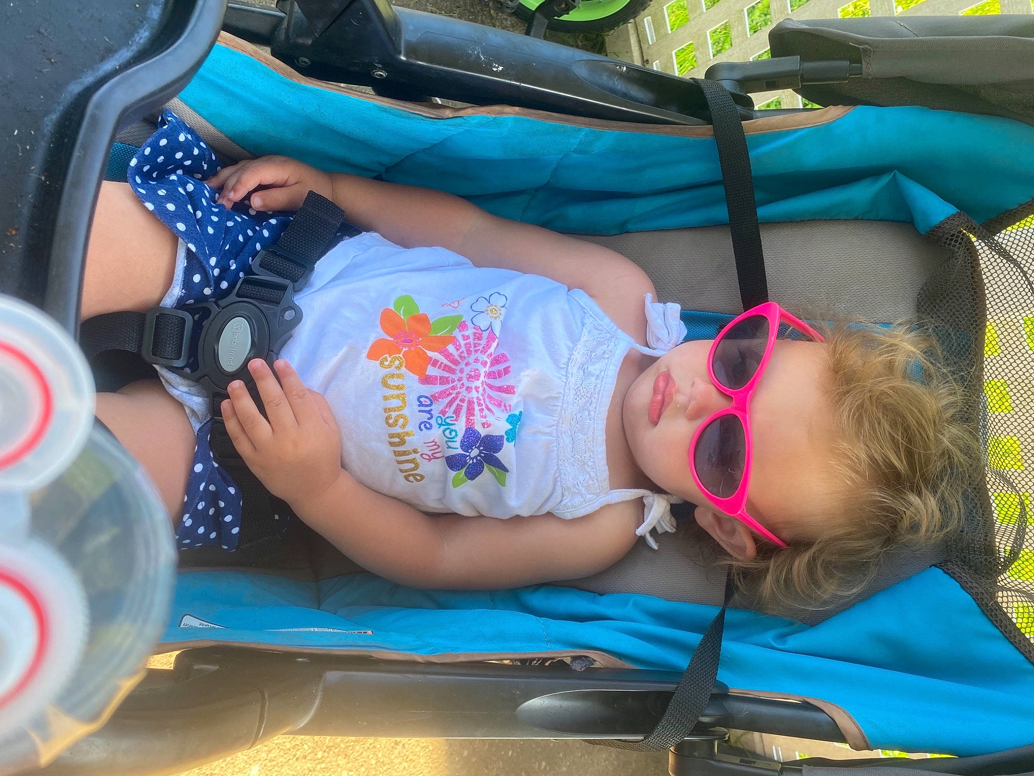 Scarlet is registered to the contest to win money with this photo: automotive_exterior, automotive_lighting, blue, bumper, child, cool, eyewear, fun, glasses, goggles, leisure, motor_vehicle, person, product, recreation, shorts, summer, sunglasses, thigh, vehicle_door
