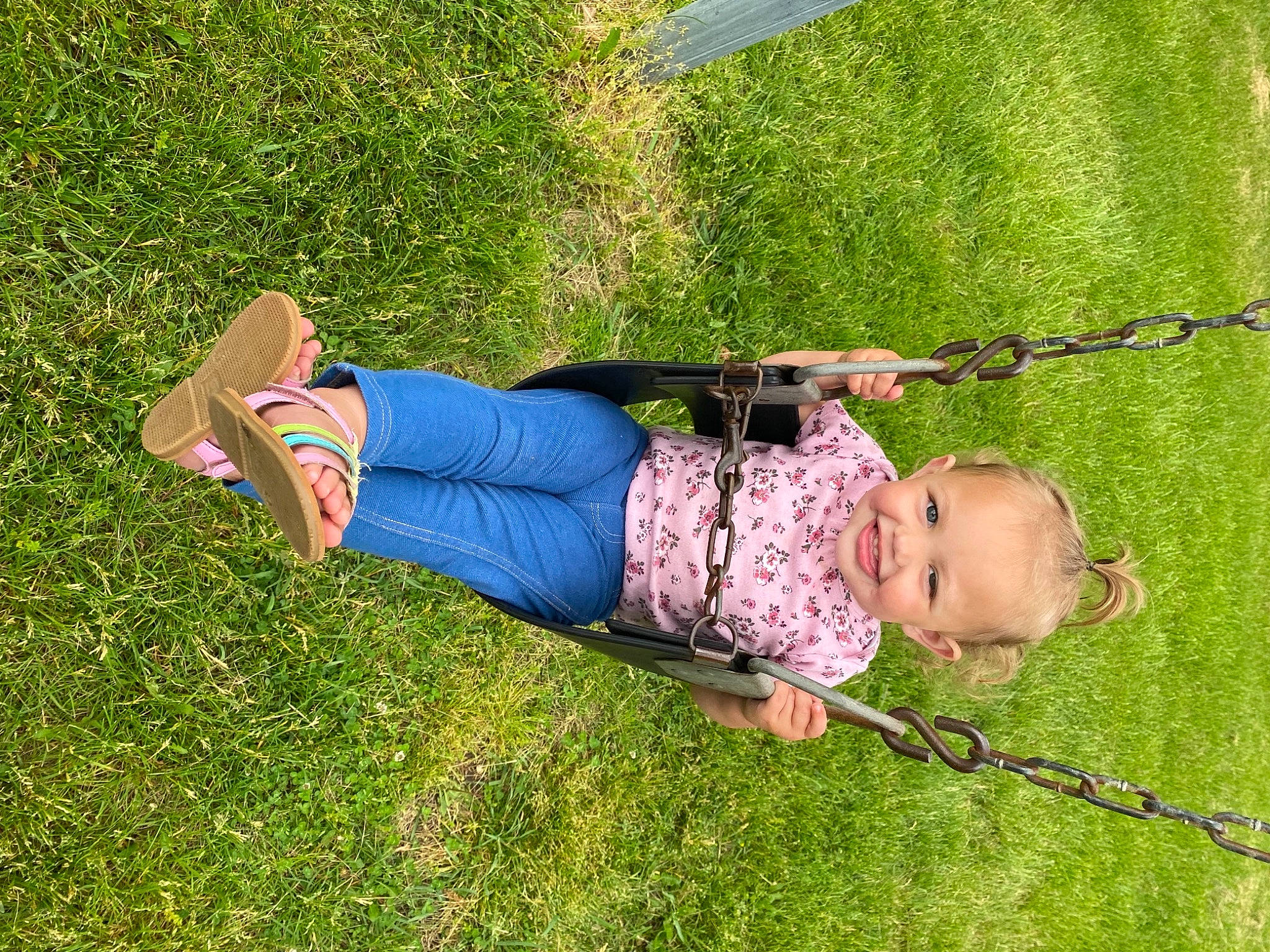 Scarlet is registered to the contest to win money with this photo: baby, baby_toddler_clothing, child, fun, grass, grass_family, grassland, happy, joy, landscape, lawn, leisure, people_in_nature, person, plant, play, recreation, sandal, sitting, toddler