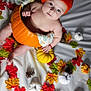 baby, pumpkin, orange_hat, autumn_leaves, pine_cones, white_sheet, small_pumpkins, fall_theme, cute, child, seasonal, festive, portrait, indoors, soft_light, holiday, costume, baby_pose, colorful, adorable