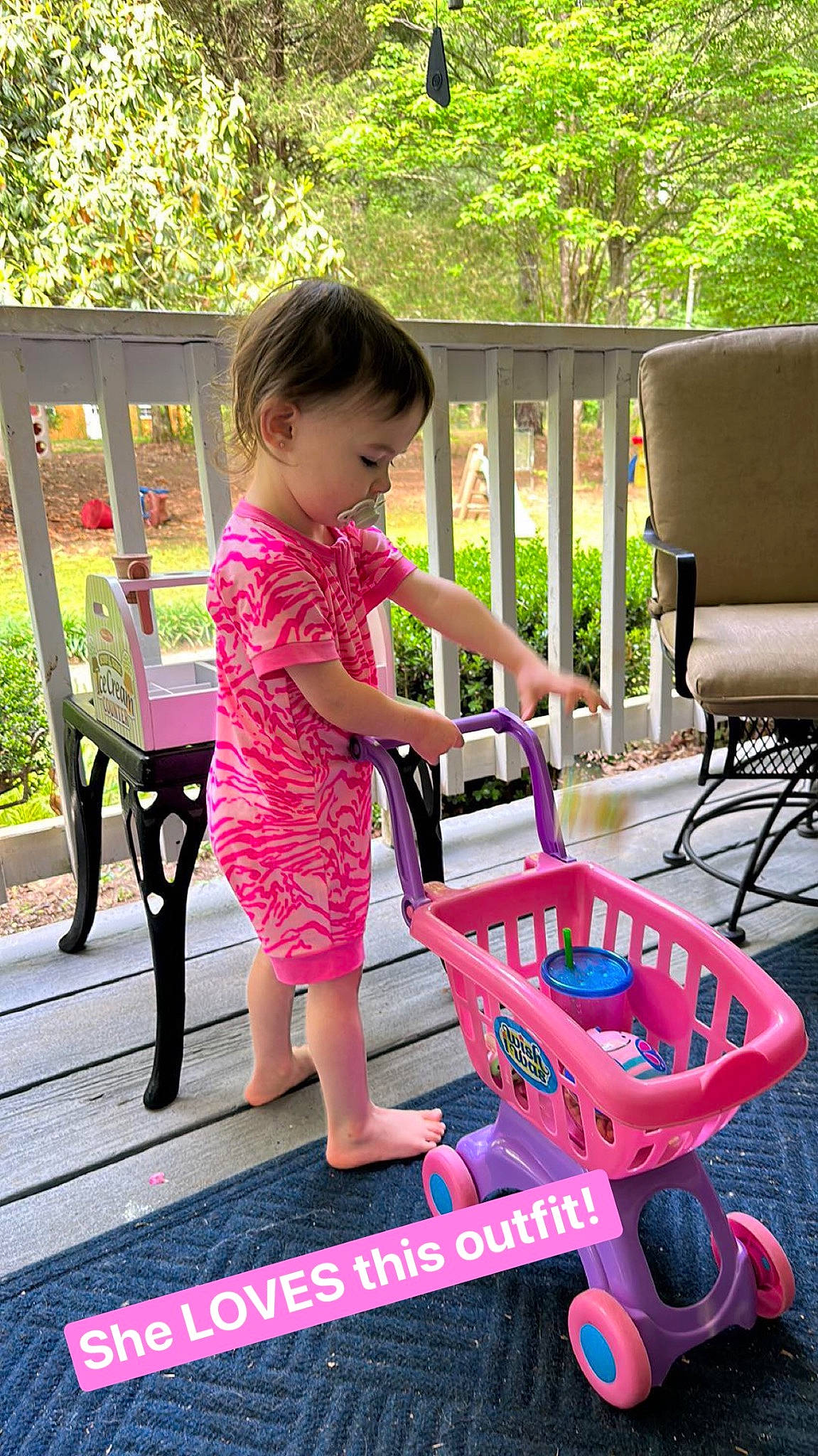 Aurora joined the competition — help win amazing prizes! baby, baby_toddler_clothing, child, fun, grass, green, happy, leisure, magenta, outdoor_furniture, person, pink, plant, recreation, riding_toy, sitting, tire, toddler, tree, vehicle