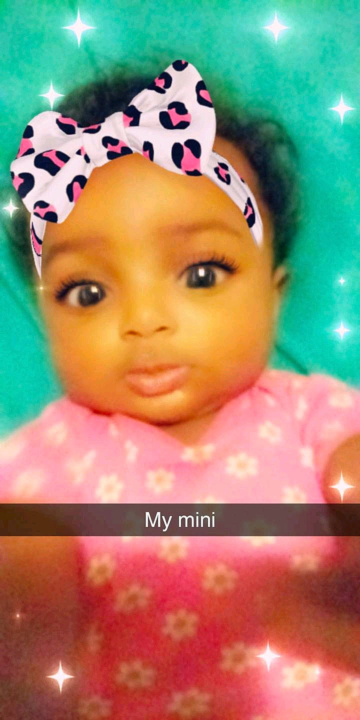 Samiya is registered to the contest to win money with this photo: baby, cheek, child, close_up, doll, eyebrow, eyelash, face, forehead, hair_accessory, head, headgear, lip, nose, person, pink, smile, toddler