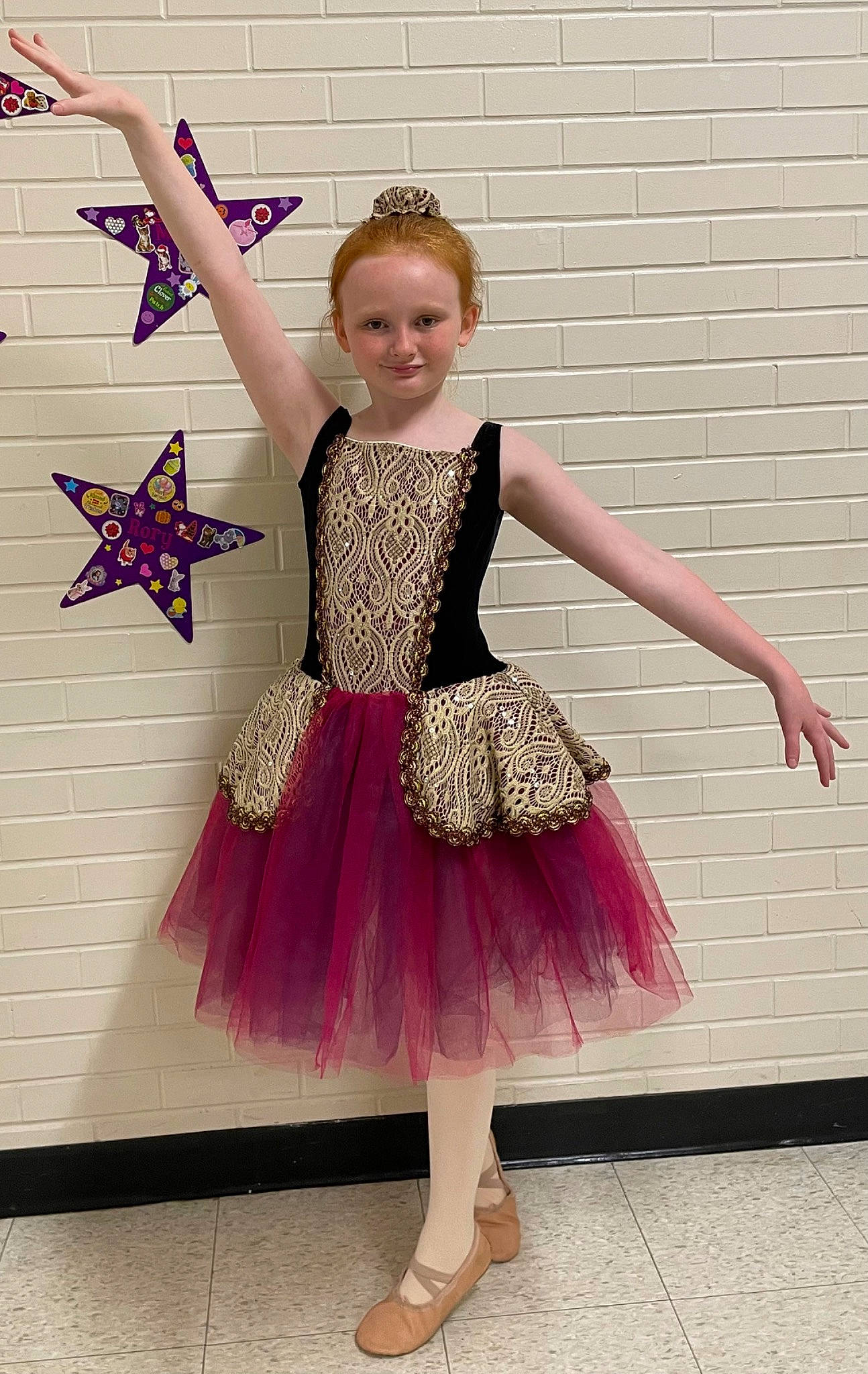 Rory is registered to the contest to win money with this photo: arm, baby_toddler_clothing, dance, dress, entertainment, footwear, happy, human_body, joint, joy, leg, neck, outerwear, performing_arts, person, pink, purple, shoulder, sleeve, smile